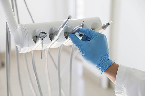 Professional Tooth Extraction technician working in Belmont, CA